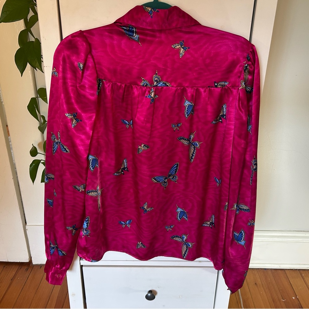 Women’s silky hot pink long sleeve button-down blouse with butterfly print
